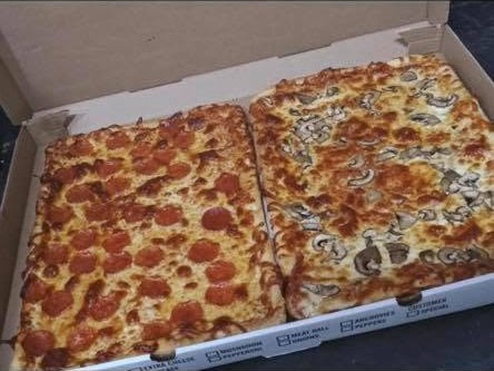Two fresh sheet pizzas in a box from Grafton's — pepperoni and mushroom